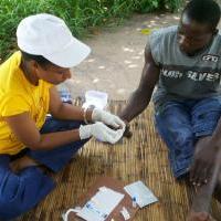 Community health worker in Mozambique tests for HIV. (Photo courtesty of Jhpiego.) Community health worker in Mozambique tests for HIV. (Photo courtesty of Jhpiego.)